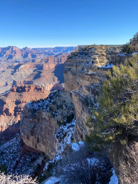 Snowy Cliffs at the Grand Canyon Snow clings to the shadows on the cliffs of the Grand Canyon. yaki point stock pictures, royalty-free photos & images