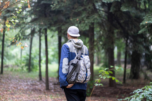 istock male hiker in the forest with a backpack outdoors 1440132411