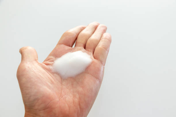 istock White foam on the palm 1440132578