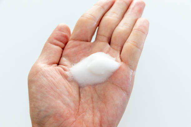 istock White foam on the palm 1440132582