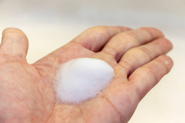istock White foam on the palm 1440132589