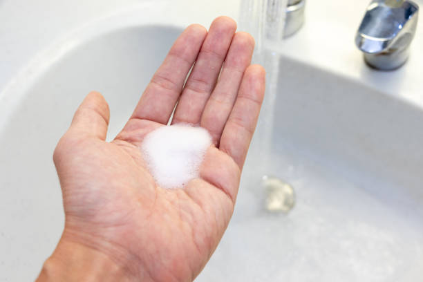 istock Soapy white foam on the palm 1440132590