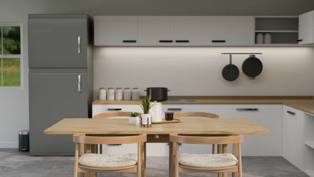 istock Modern contemporary kitchen with table, counter with wooden top, modern grey fridge 1440133951