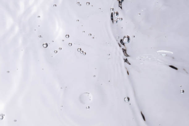 istock Underwater bubble texture on white background. Water with bubbles. Air bubbles underwater 1440135038