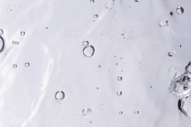 istock Underwater bubble texture on white background. Water with bubbles. Air bubbles underwater 1440135087