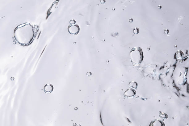 istock Underwater bubble texture on white background. Water with bubbles. Air bubbles underwater 1440135093