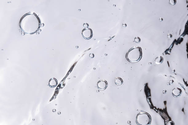 istock Underwater bubble texture on white background. Water with bubbles. Air bubbles underwater 1440135095