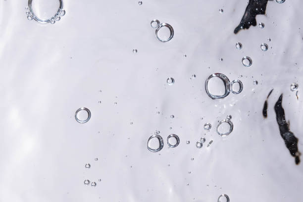 istock Underwater bubble texture on white background. Water with bubbles. Air bubbles underwater 1440135108