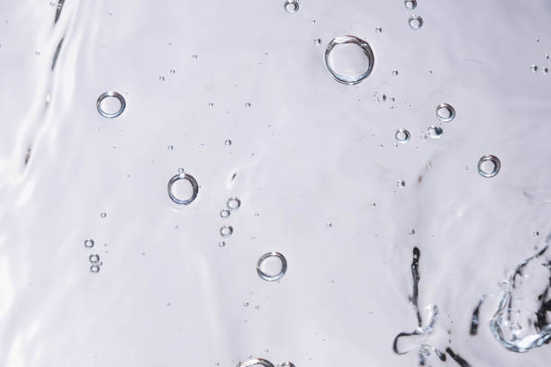 istock Underwater bubble texture on white background. Water with bubbles. Air bubbles underwater 1440135112
