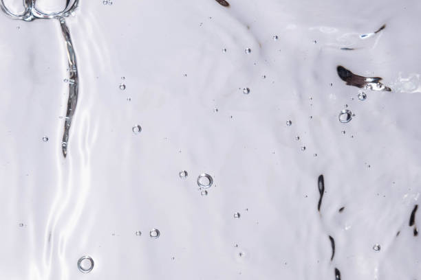 istock Underwater bubble texture on white background. Water with bubbles. Air bubbles underwater 1440135120