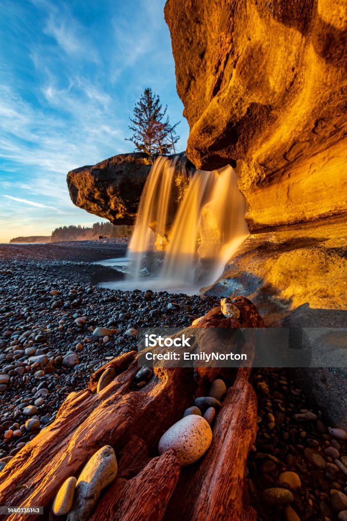 Sandcut Beach, Vancouver Island Beautiful waterfall flowing over the sandstone along the west coast of Vancouver Island. Pacific Northwest Stock Photo