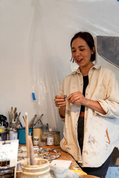 istock Artists workshop. Canvas, paint, brushes, palette knife lying on the table. 1440140509
