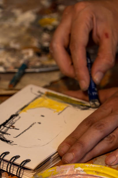istock Artists workshop. Canvas, paint, brushes, palette knife lying on the table. 1440141324