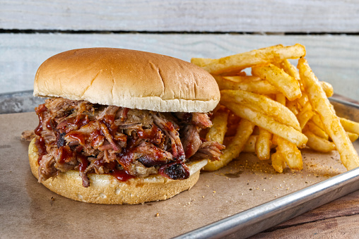 BBQ pulled pork sandwich and fries.