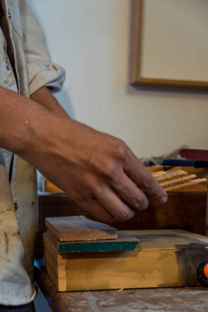 istock Artists workshop. Canvas, paint, brushes, palette knife lying on the table. 1440147298