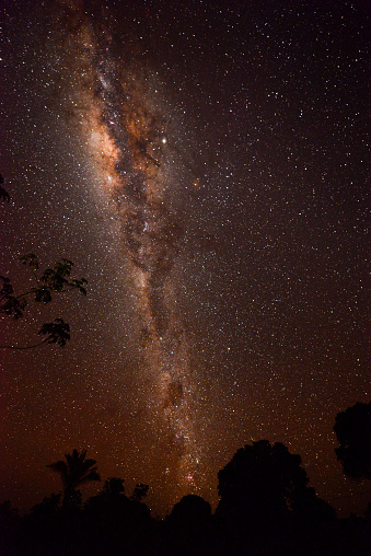The Milky Way above the Guaporé-Itenez river and the rainforest surrounding the small, remote Amazonian village of Cafetal, Beni Department, Bolivia, on the border with Rondonia state, Brazil