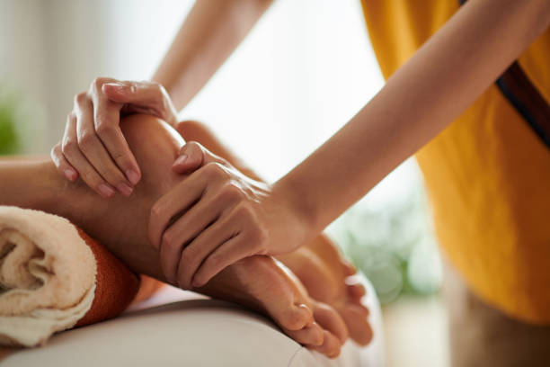 Woman Receiving Feet Massage stock photo