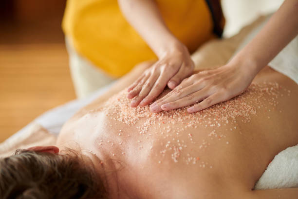 istock Masseuse Massaging Back of Woman 1440149663