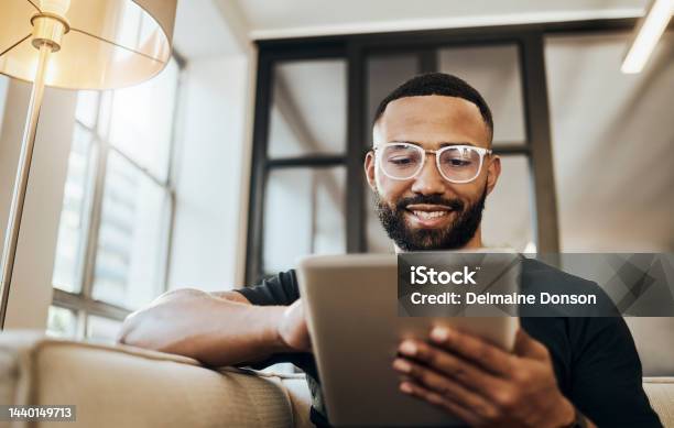 Black Man Tablet And Smile For Social Media Post Shopping Online Or Browsing Internet Creative Content At Home Young Africa American Happy Relax And Calm On Tech Digital App On Device Stock Photo - Download Image Now