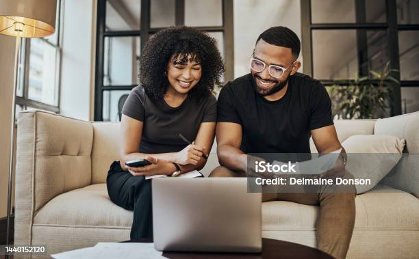 Planning Finance And Couple With Paper And Laptop For Budget Insurance And Savings On Sofa Of Their House Happy Young And Man And Woman Learning About Online Investment And Loan With Documents Stock Photo - Download Image Now