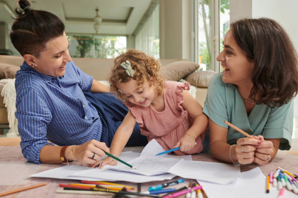 istock Mothers and Daughter Drawing Pictures 1440155459