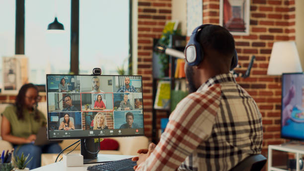 istock Businessman attending online corporate meeting on computer 1440156067