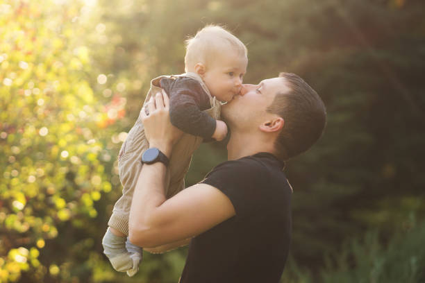 istock Father with baby boy outdoor 1440156808