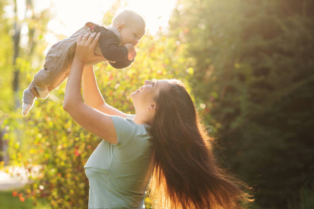 istock Mother with baby boy outdoor 1440156843