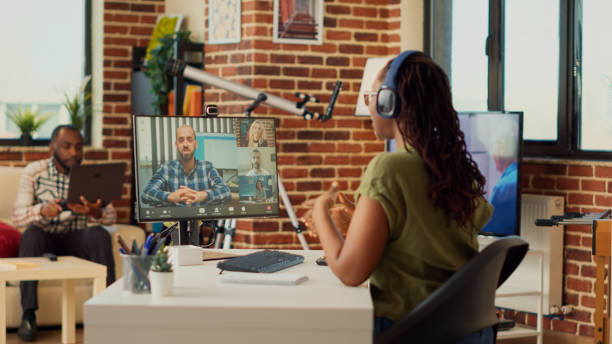 istock Young freelancer attending remote videocall meeting on computer 1440157019