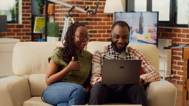 istock Young couple enjoying free time at home together 1440157169