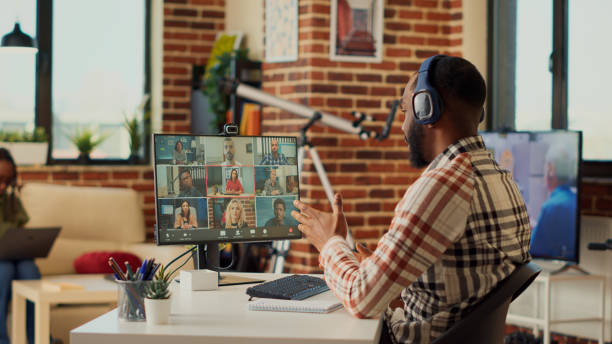 istock Male manager attending corporate videocall meeting on computer with webcam 1440157187