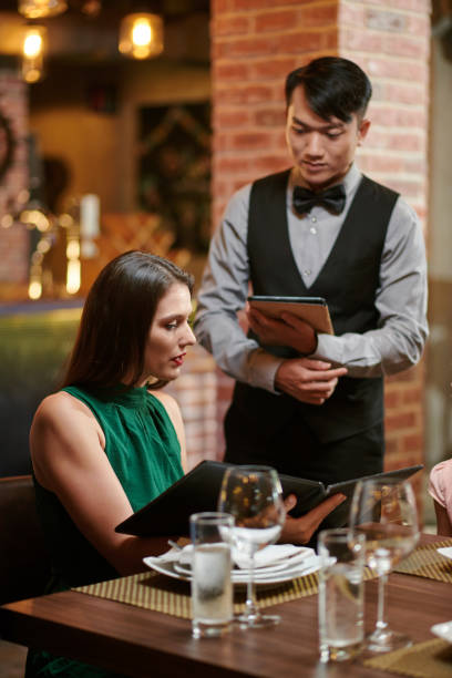 istock Woman Making Order in Restaurant 1440158199