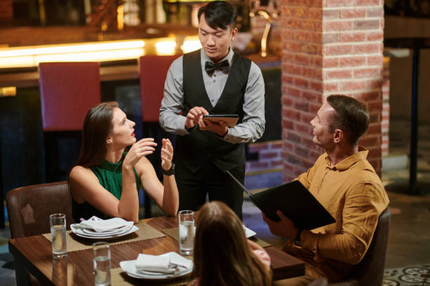 istock Woman Asking Waiter for Recommendations 1440158216
