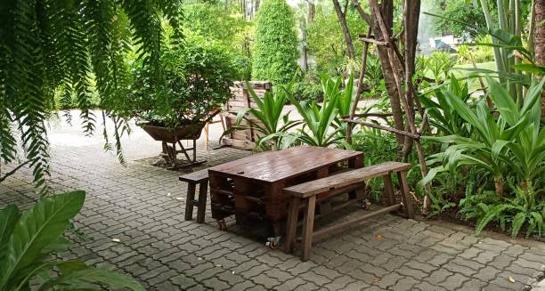 istock Wood retro table in garden. 1440160255