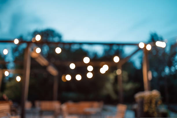 istock Closed up romantic light bulb blurred for restaurant and cafe night background. 1440161949