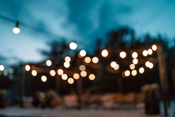 istock Closed up romantic light bulb blurred for restaurant and cafe night background. 1440162013