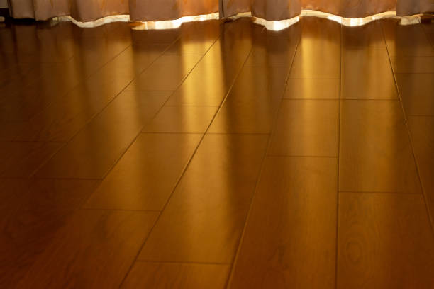 istock Wood flooring that reflects the sunlight from the window 1440164212