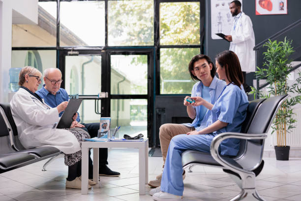 istock Physician nurse consulting asian patient with glucometer while measuring insulin and glucose level 1440164418