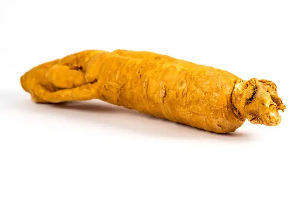 Photo of ginseng root on a white background