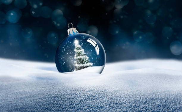 transparente glas-weihnachtskugel im schnee - weihnachtskarte stock-fotos und bilder