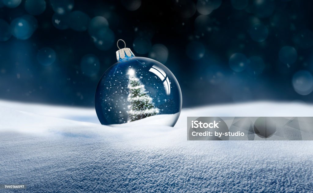 Transparent glass Christmas ball in snow Christmas Stock Photo