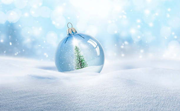 istock Transparent glass Christmas ball in snow 1440166676