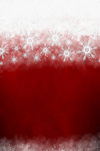 White colored mist with snowflakes at the  top and bottom of a red vertical Christmas backgrounds. Can be used as Xmas , New Year day celebrations background, wallpapers, gift wrapping sheets, posters, banners and greeting cards. Small glitter like or glittery dots shining here and there.