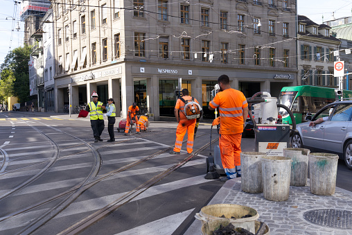 Construction workers at tram station Bankverein at City of Basel on a sunny summer day. Photo taken August 24th, 2022, Basel, Switzerland.