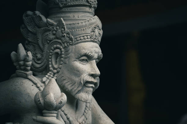 Traditional sculpture made of stone seen in the jungle of the Bali island, Indonesia.