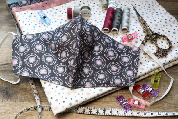 istock Crafting a fabric facemask on the sewing machine 1440171871