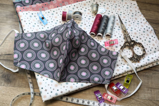 istock Crafting a fabric facemask on the sewing machine 1440172096