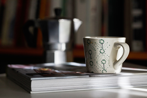 coffee break: coffee cup on book