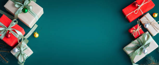 istock Banner with many gift boxes with paper decorations on turquoise background. Christmas background. 1440172529