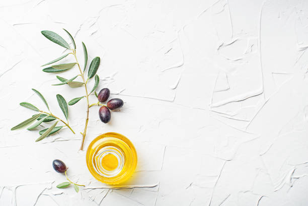istock Olive oil bottle with olive branch 1440179158